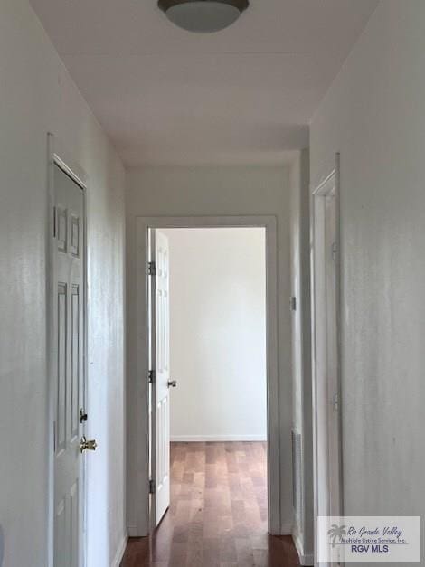1056 E Mile 11, Weslaco, TX 78599 - hall with wood finished floors and baseboards