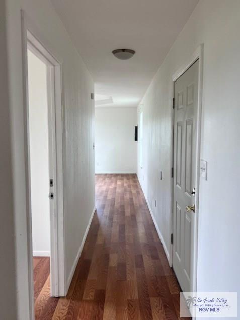 1056 E Mile 11, Weslaco, TX 78599 - corridor featuring wood finished floors and baseboards