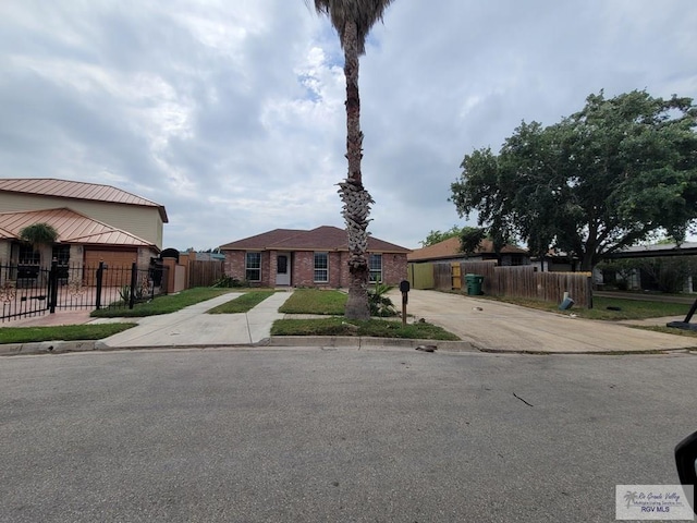 view of front of property with brick siding and fence