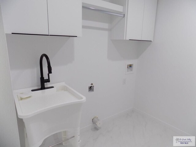 laundry room with washer hookup and sink