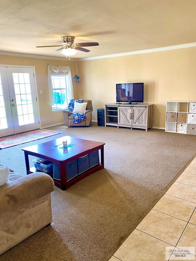 recreation room with ceiling fan, ornamental molding, carpet, and a textured ceiling