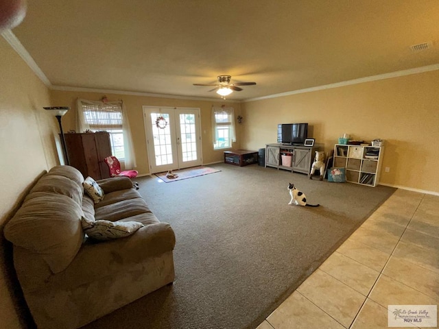 carpeted living room with ceiling fan and ornamental molding