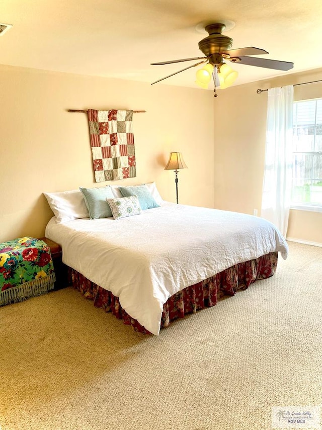 bedroom featuring ceiling fan and carpet flooring