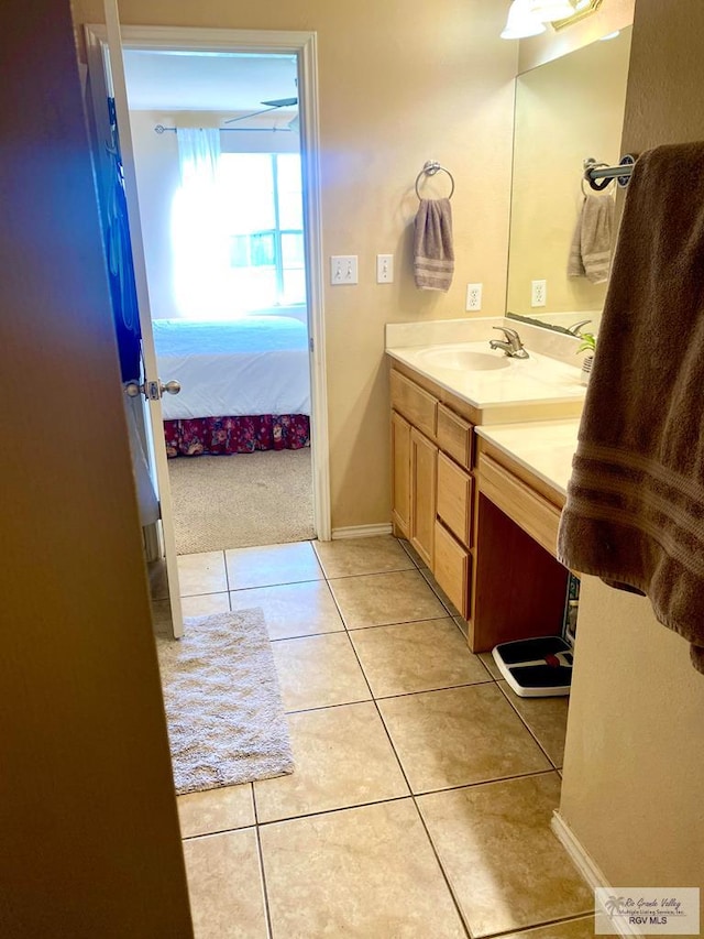 bathroom with tile patterned flooring and vanity