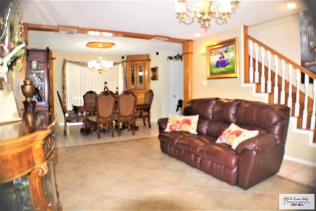 tiled living room with a chandelier