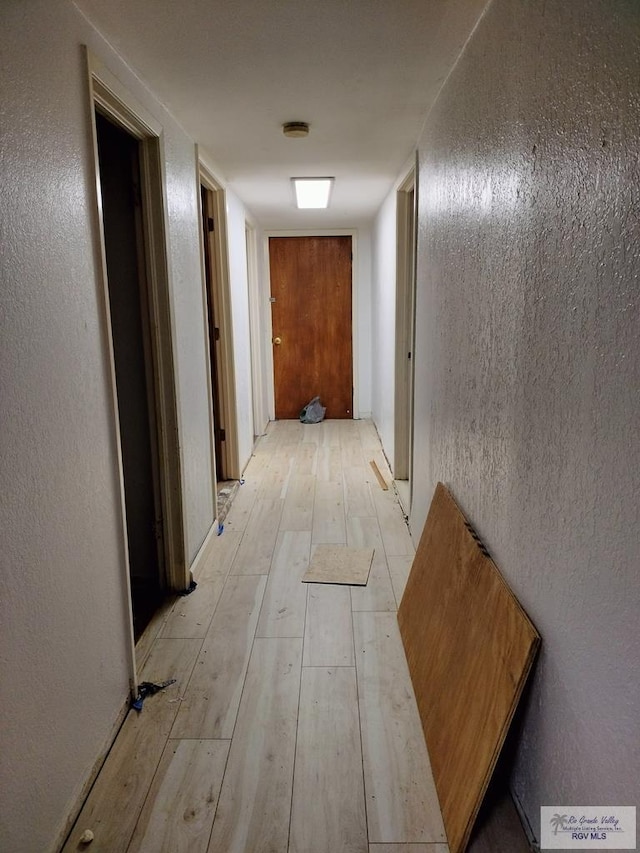 corridor featuring light wood-type flooring