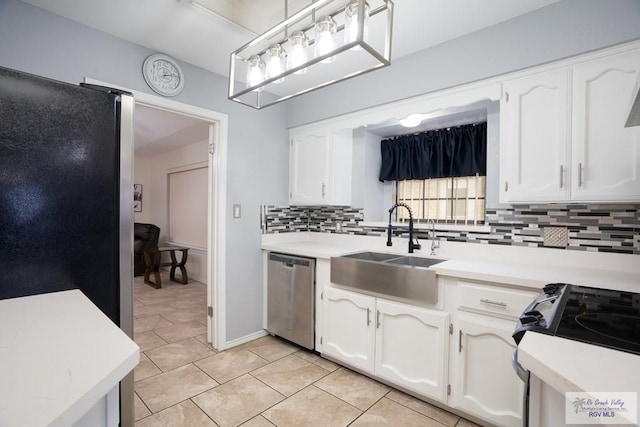 kitchen featuring appliances with stainless steel finishes, white cabinetry, and sink