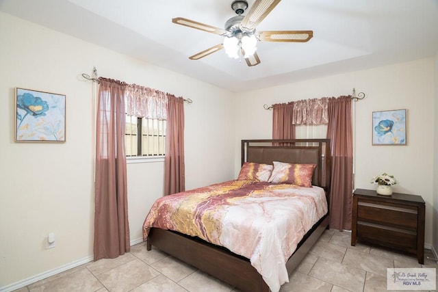 bedroom with light tile patterned floors and ceiling fan