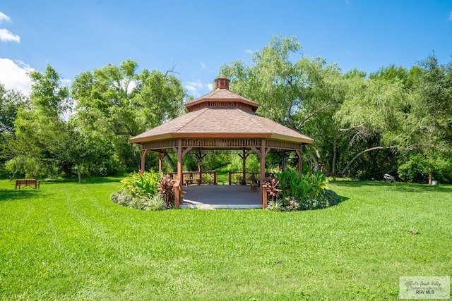 view of community featuring a gazebo and a lawn