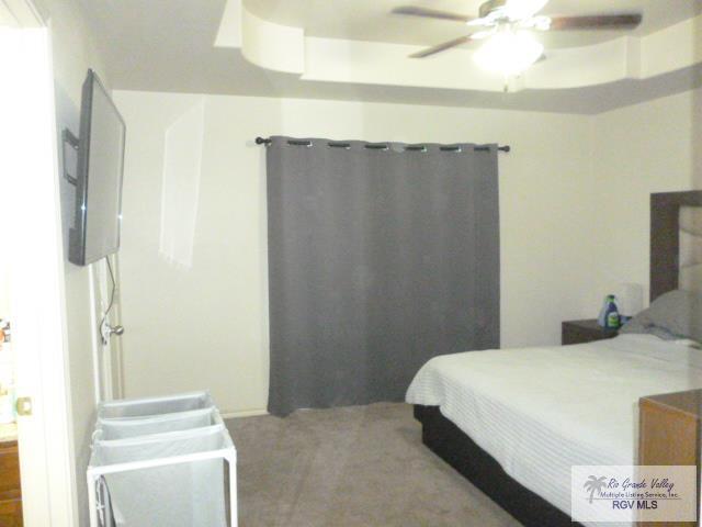 3937 Oak Valley Dr, Brownsville, TX 78520 - bedroom with carpet and a ceiling fan