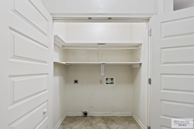 laundry room with hookup for a washing machine, light tile patterned floors, and hookup for an electric dryer