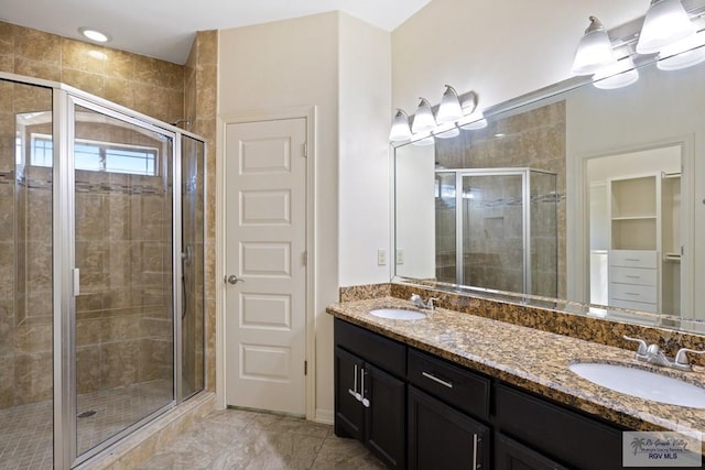 bathroom with vanity and an enclosed shower