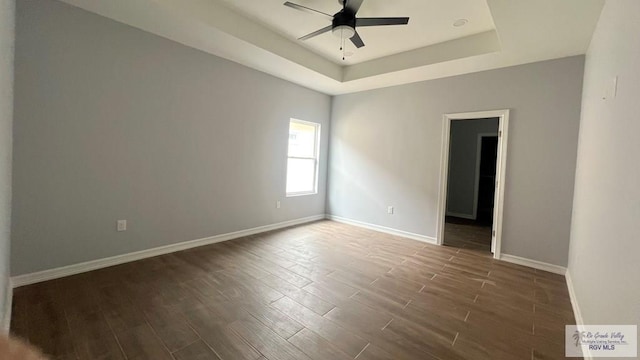 2517 S Christian Cir, Harlingen, TX 78550 - empty room featuring a ceiling fan, wood finished floors, and a tray ceiling