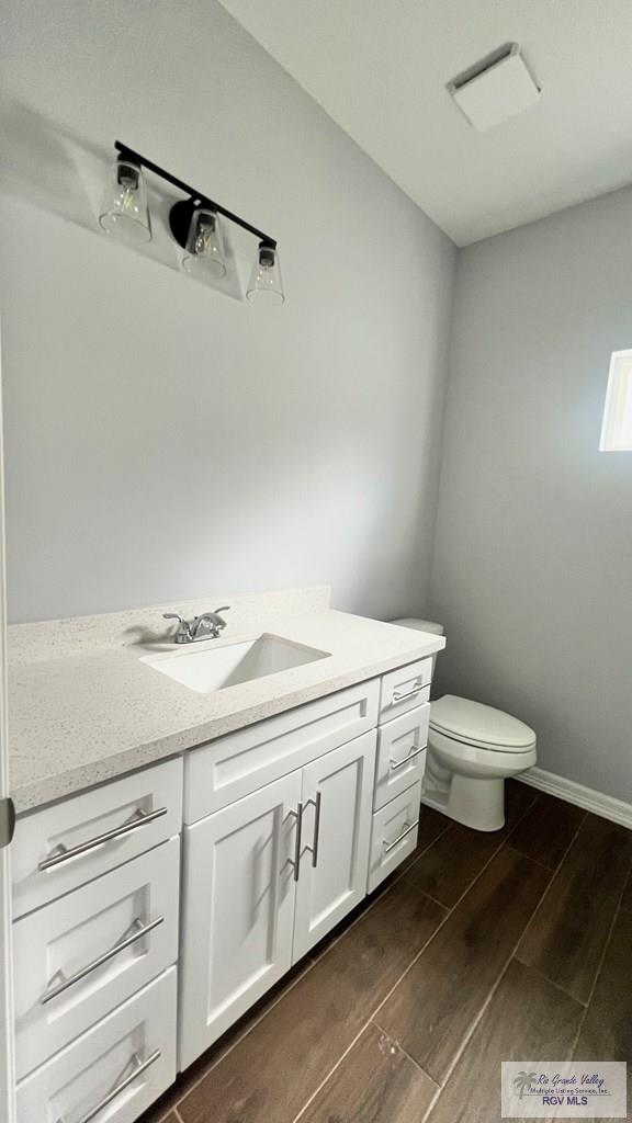 2517 S Christian Cir, Harlingen, TX 78550 - bathroom with vanity and wood tiled floors