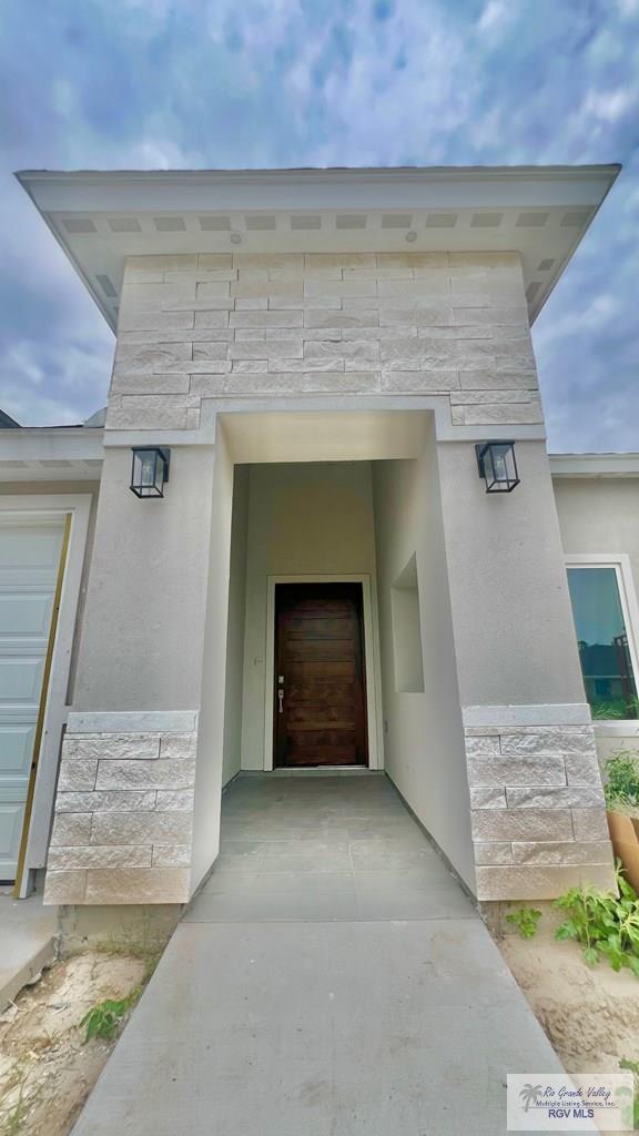 2517 S Christian Cir, Harlingen, TX 78550 - view of exterior entry with stone siding and stucco siding