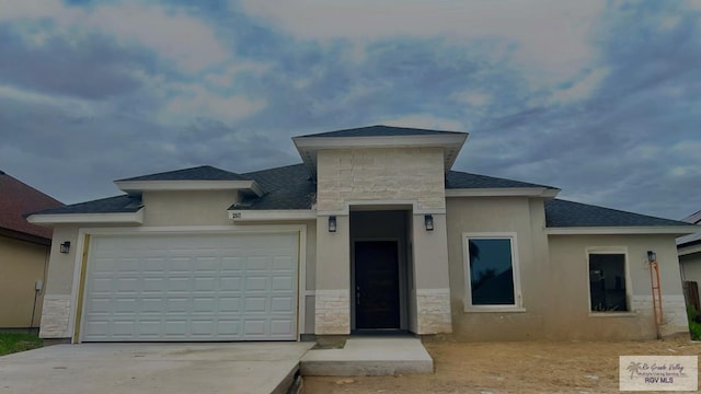 2517 S Christian Cir, Harlingen, TX 78550 - view of front of property featuring stone siding, an attached garage, driveway, a shingled roof, and stucco siding