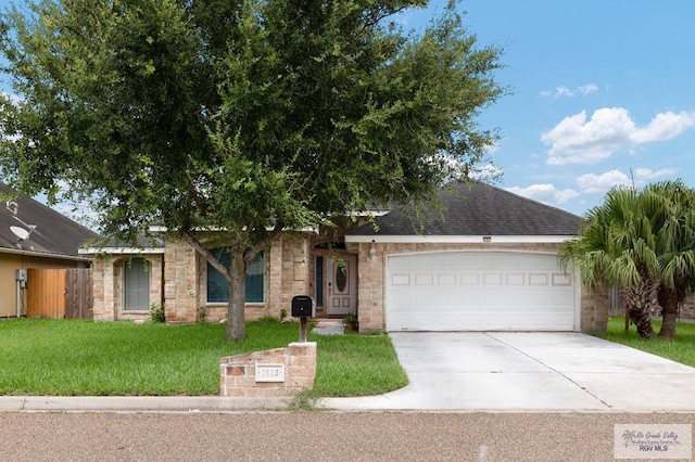 view of front of property featuring a garage and a front lawn