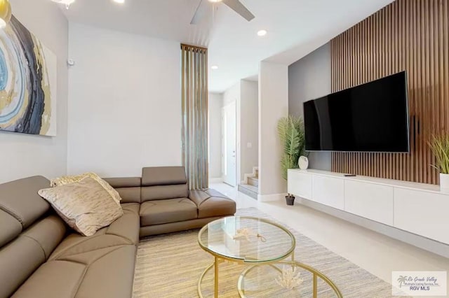 living room featuring recessed lighting, ceiling fan, and baseboards