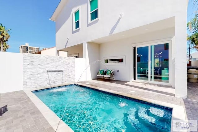 view of pool with a patio, a fenced in pool, and a fenced backyard