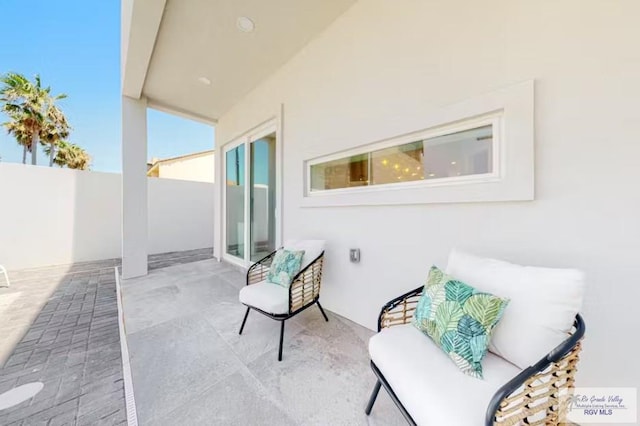 view of patio / terrace featuring fence