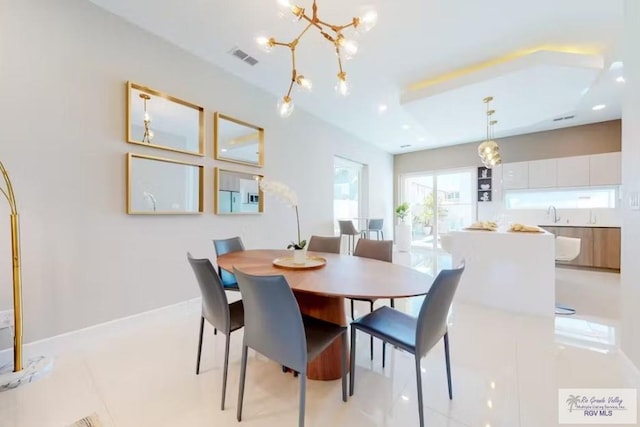 dining room featuring an inviting chandelier, recessed lighting, and visible vents