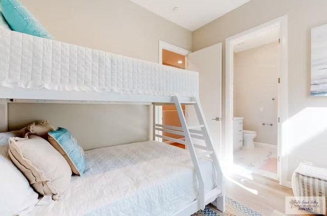 bedroom with wood finished floors