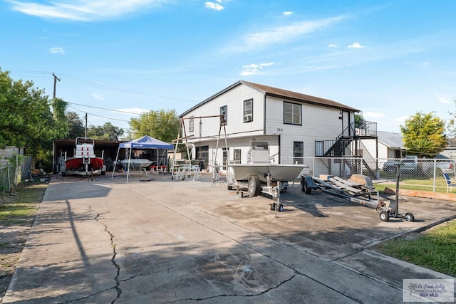 rear view of house featuring a carport