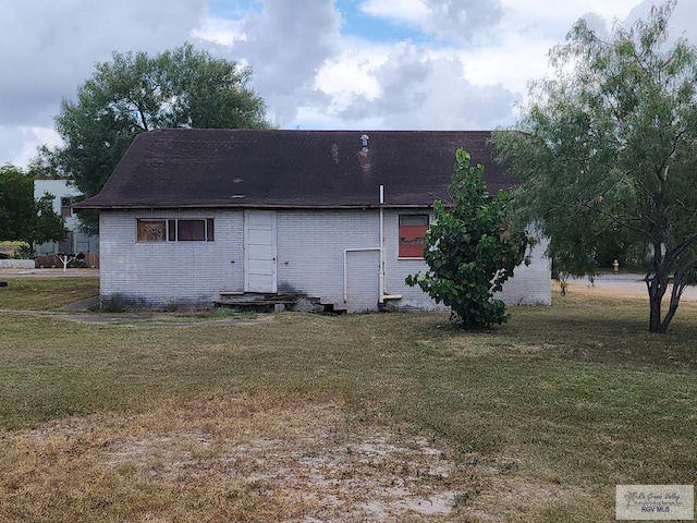 back of property with a yard