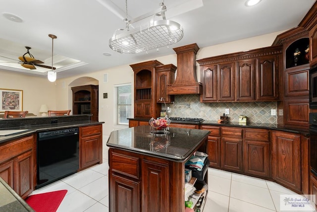 kitchen with black dishwasher, backsplash, open shelves, a tray ceiling, and custom range hood