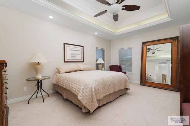 bedroom with light carpet, ornamental molding, a raised ceiling, and baseboards