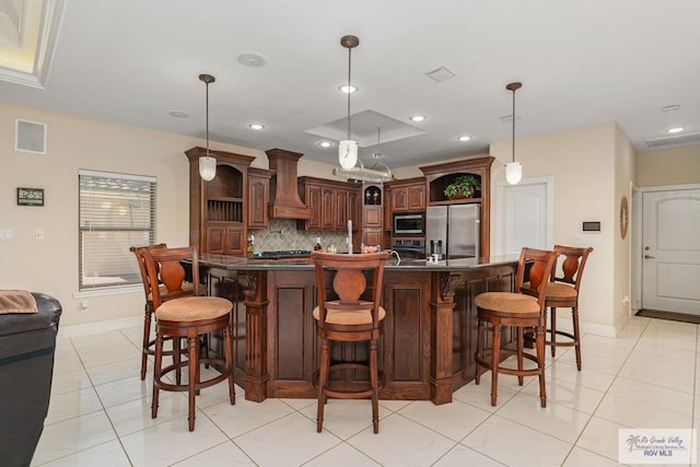 kitchen with custom exhaust hood, open shelves, dark countertops, backsplash, and appliances with stainless steel finishes