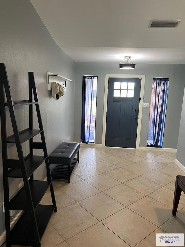 foyer with light tile patterned floors