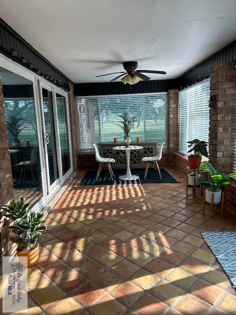 sunroom / solarium with ceiling fan