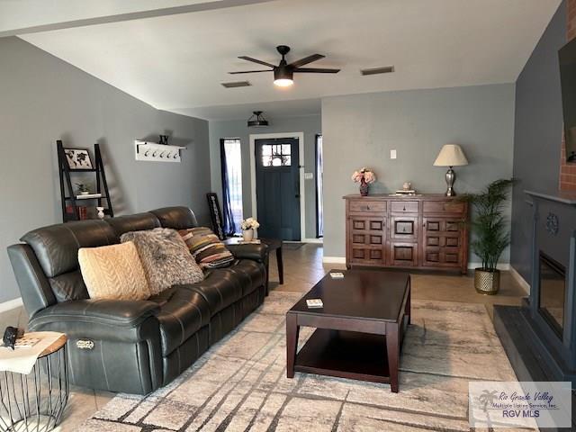 living room featuring ceiling fan