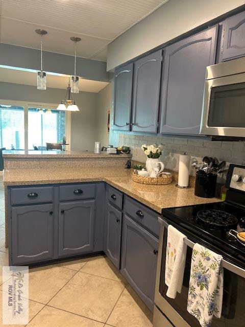 kitchen with appliances with stainless steel finishes, pendant lighting, backsplash, light tile patterned floors, and kitchen peninsula