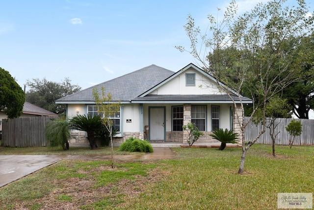 view of front of property with covered porch and a front lawn