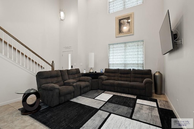 living room featuring a high ceiling