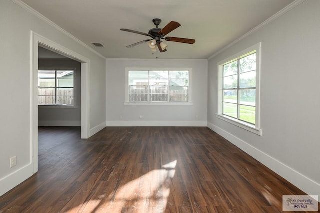 718 Pierce Ave, Harlingen, TX 78550 - unfurnished room featuring plenty of natural light, dark wood finished floors, ornamental molding, and a ceiling fan