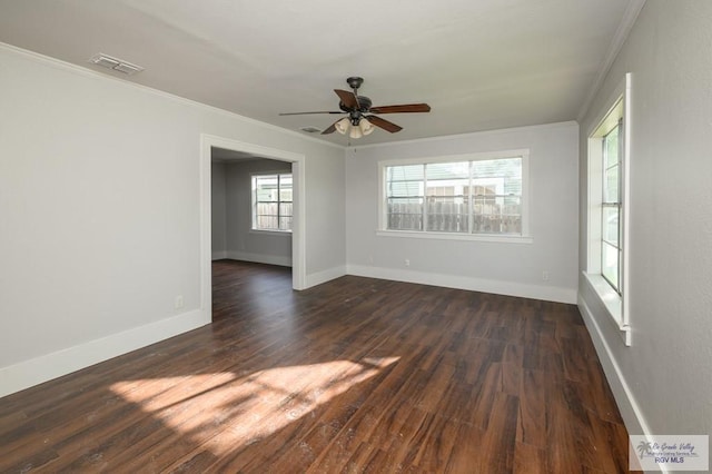 718 Pierce Ave, Harlingen, TX 78550 - spare room with ornamental molding, a ceiling fan, and dark wood-style flooring