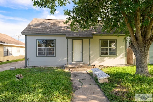718 Pierce Ave, Harlingen, TX 78550 - view of front facade with a shingled roof