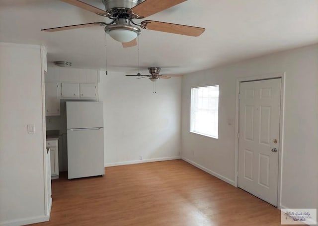 interior space featuring ceiling fan and light hardwood / wood-style floors