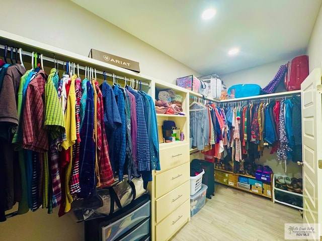 walk in closet featuring light hardwood / wood-style floors