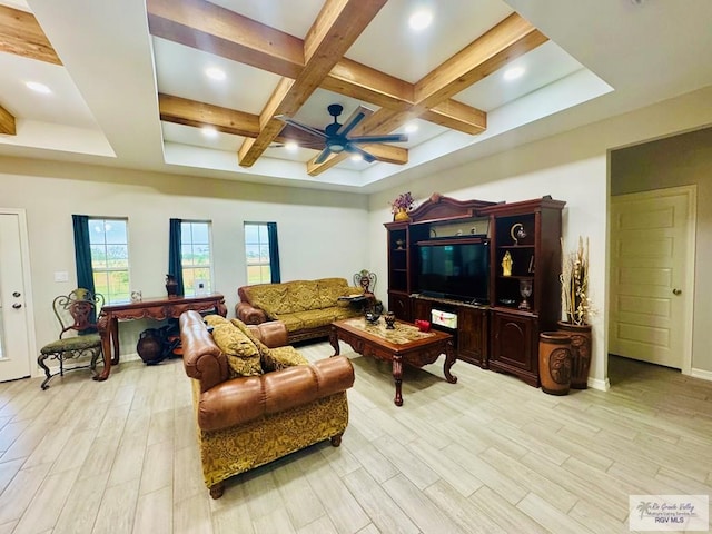 living room featuring beamed ceiling, coffered ceiling, ceiling fan, and light hardwood / wood-style floors