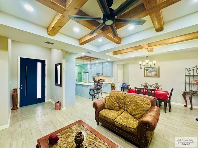 living room with coffered ceiling, beam ceiling, and light hardwood / wood-style flooring