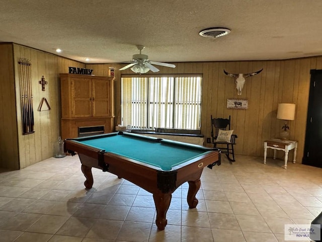 game room with visible vents, ceiling fan, wooden walls, a textured ceiling, and pool table