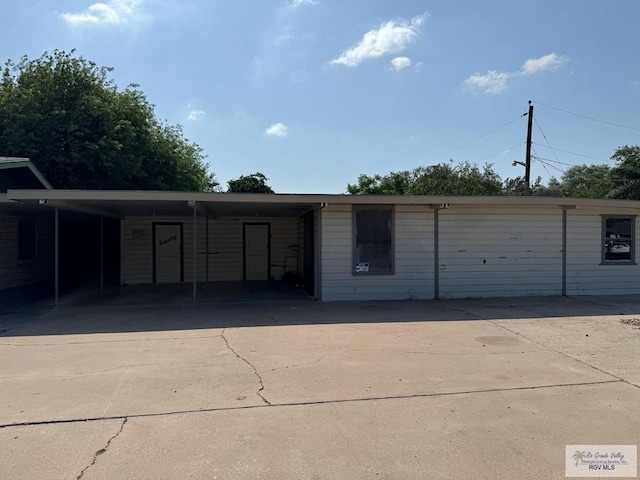 exterior space featuring a carport