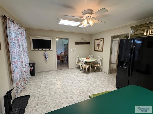 dining space with ornamental molding, ceiling fan, and light tile patterned flooring