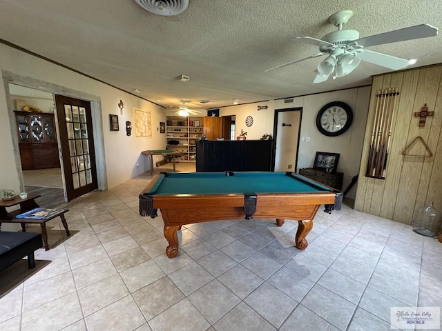 recreation room with a ceiling fan, pool table, light tile patterned flooring, and a textured ceiling