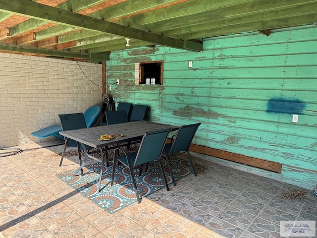 view of patio featuring outdoor dining area