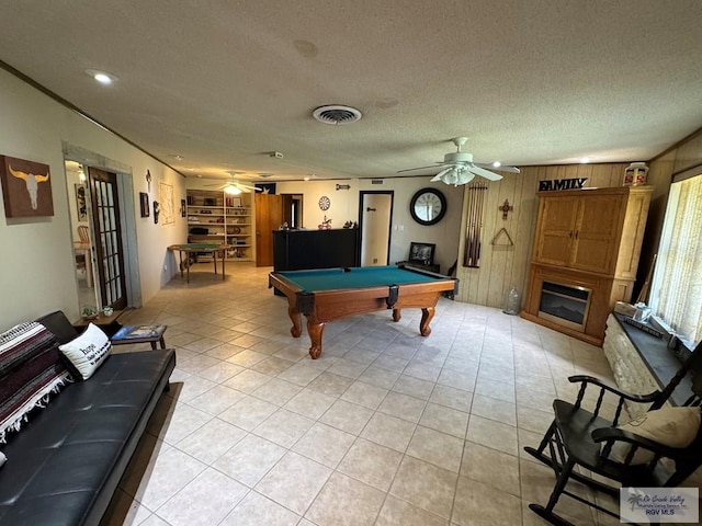 rec room with wooden walls, a ceiling fan, pool table, and visible vents